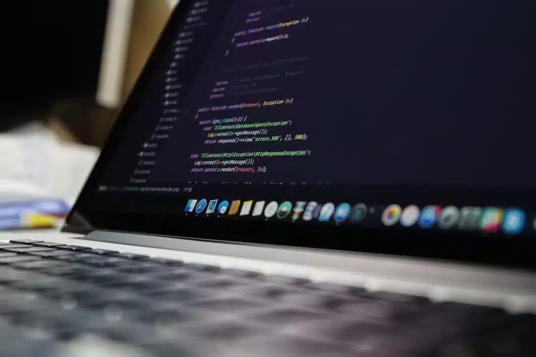 Laptop showing a code editor interface